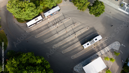Top down aerial view of bus terminal with parked buses in Wangen im Allgäu