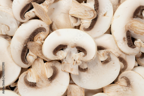 Pile of fresh sliced champignon mushrooms for background, Top view