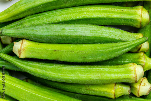 Pile of fresh raw okra pods. Top view