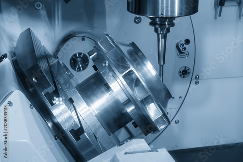 High-precision 5-axis CNC milling machine performing a finish cut on water turbine parts with a ball nose end mill tool.