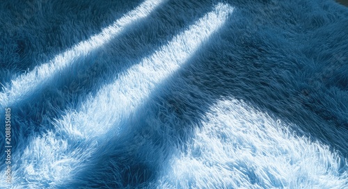 Soft, fluffy blue textile with angled sunlight creating striped shadows
