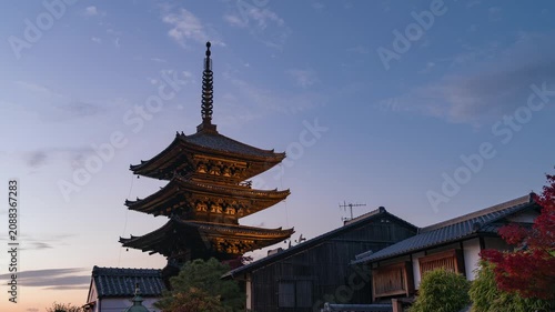 Dusk to night timelapse of the historic Gion district during autumn season in Kyoto, Japan, zooming in.