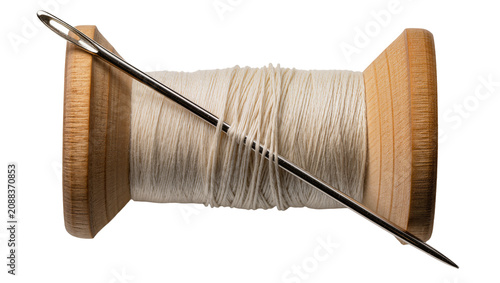 Obraz na płótnie Wooden thread spool with cream thread and metal needle, isolated on transparent