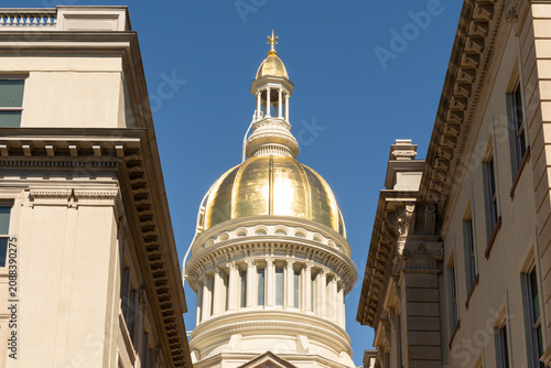 Photos Architectural detail of the gold dome and roofline of the historic New Jersey State House in Trenton, New Jersey
