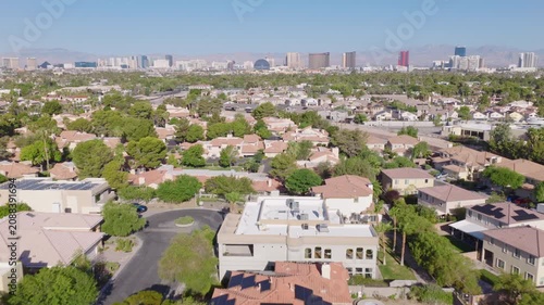 Las Vegas Neighborhood Pullback Aerial with Strip Skyline and Mountain View 01