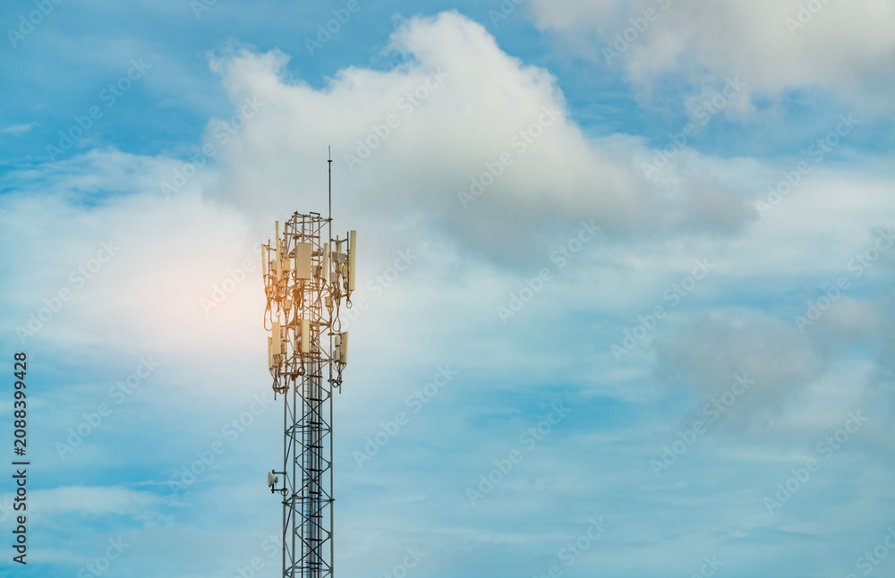 Obraz premium Telecommunication tower with blue sky and clouds. Antenna. Radio and satellite pole. Communication technology. Telecommunication industry. Mobile or telecom 5g network. Telecommunication industry.