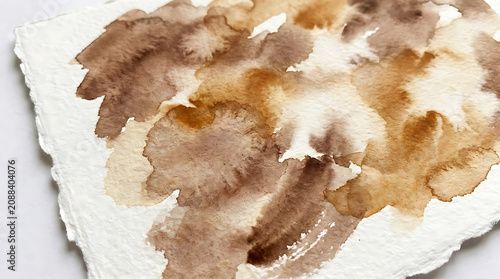 Abstract watercolor paint splatter and stain texture on textured paper