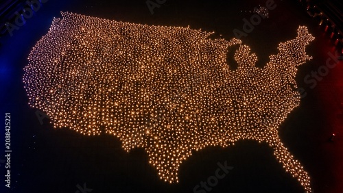 Anonymous light points forming USA map filled with stars from above