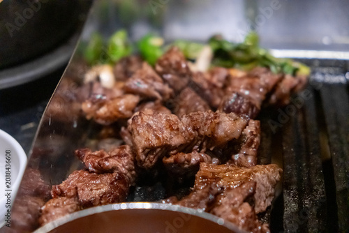 Sirloin Hanwoo Beef, marbled Korean Style Meat on the Grill. BBQ rare meat with soft focus