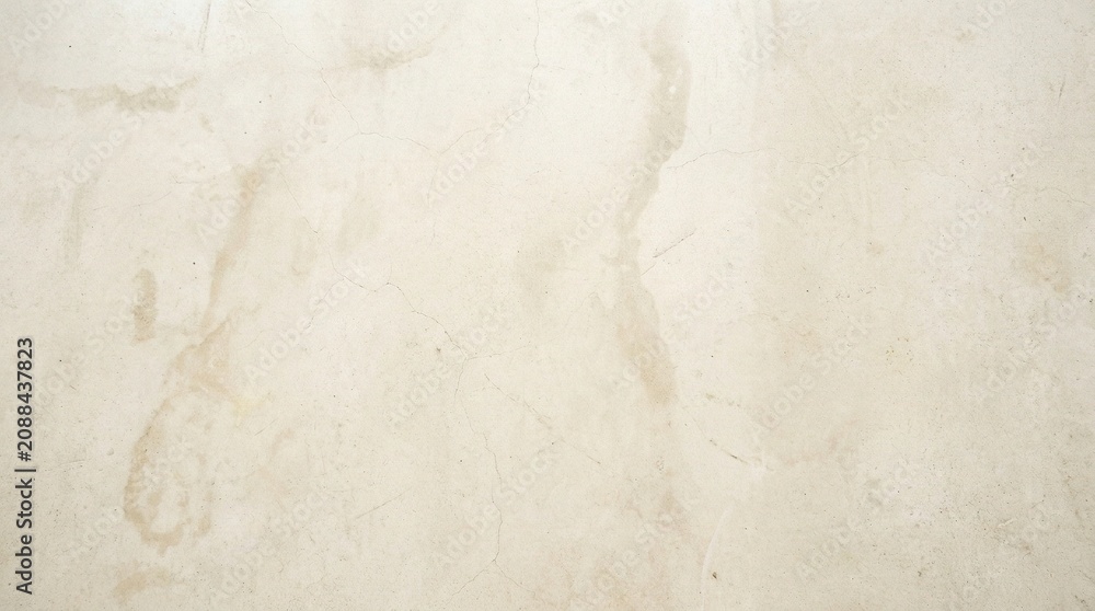 Fototapeta premium Cream marble surface features subtle tan veining and a polished finish ideal for luxury interior design and home decor.