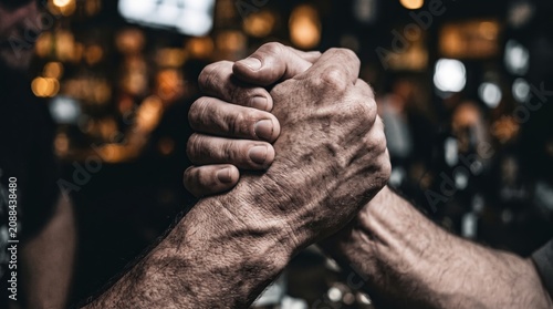Powerful business handshake close up representing confidence leadership partnership and corporate success
