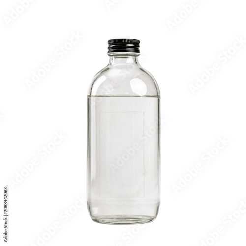 Clear glass bottle filled with transparent liquid and a black screw cap, featuring a blank rectangular label area, isolated on white background