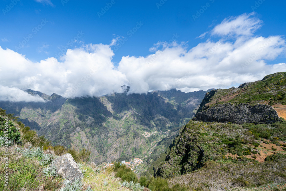 Fototapeta premium Viewpoint in Porto Moniz, Madeira, Portugal. Spectacular panoramic view overlooking the rugged Atlantic coastline, volcanic rock formations, and the scenic beauty of Madeira Island. A breathtaking tra
