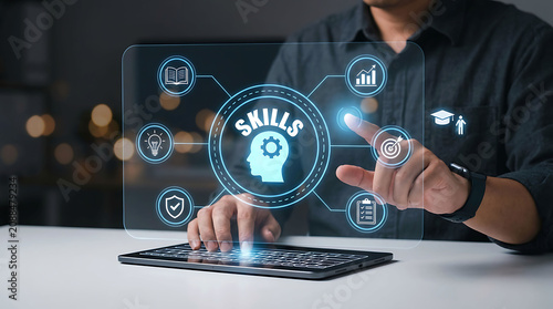 Businessman pointing at skills professional development digital network interface on tablet keyboard