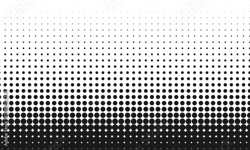 Black dots pattern transition from small to large on grey background.