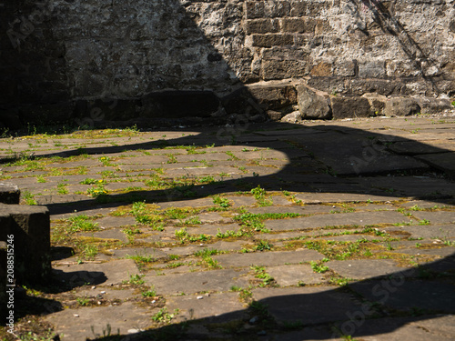 Fotografie Shadow of archways at Saint Thomas a Becket Abbey Church ruins in Yorkshire