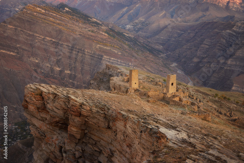Ruins and towers of the aul ghost Goor in Dagestan in the evening light