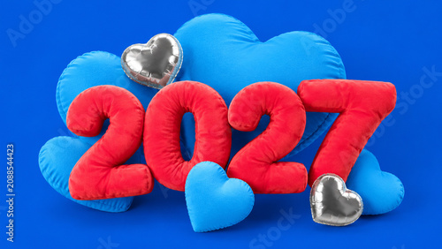 Red plush 2027 numbers with blue hearts on a bright studio background.