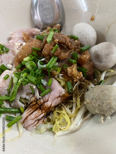 Beef noodle soup. Thai noodle soup. Thai food. Asian food. Braised beef. Beef meatballs. Noodles. Hot broth. Chopsticks. Homemade food. Bowl of noodles. Comfort food.