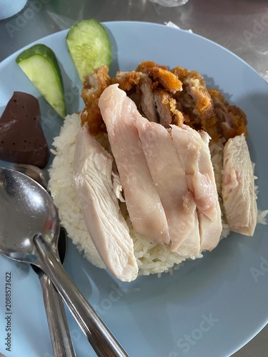 Hainanese chicken rice. Thai chicken rice. Thai food. Asian food. Boiled chicken. Fried chicken. Chicken rice. Rice dish. Traditional food. Chicken Rice.