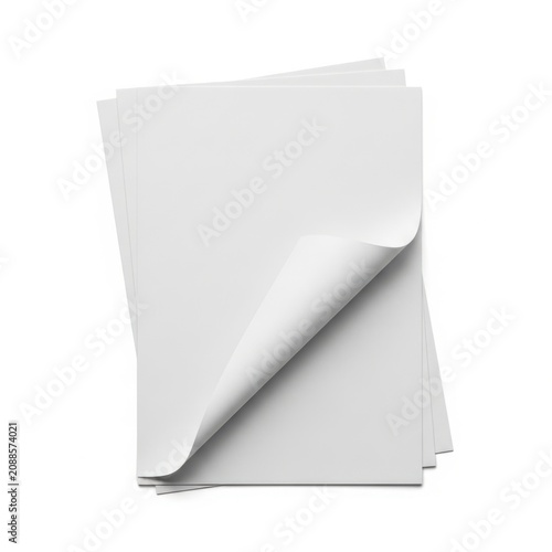 Stack of plain white paper sheets with one corner turned up