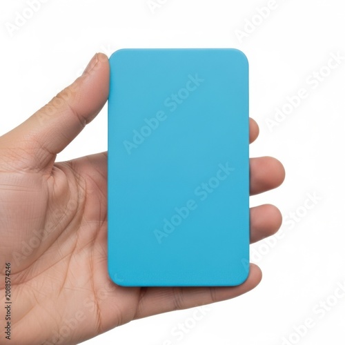 A hand holding a solid blue portable power bank or external battery pack.