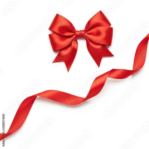 Elegant red satin bow with a flowing ribbon on a white background