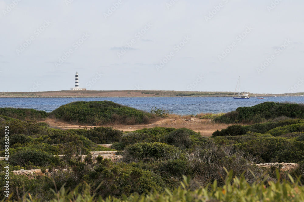 Fototapeta premium Küste bei Punta Prima mit Leuchtturm