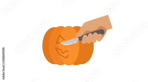 Fotografija Hand carving a jack o lantern.