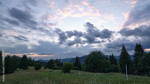evening sky over serene outdoor landscape with trees and grass. tranquil scene captured with fixed viewpoint, natural blue and white tones, clean background for copy space.