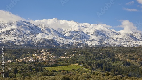Winter landscape, snow-capped White Mountains, Lefka Ori, village, green fields, olive groves, blue hummel, clear weather, Apokoronas, Chania province, Crete, Greece