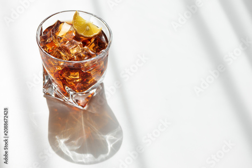 Refreshing iced coffee drink with lemon and ice