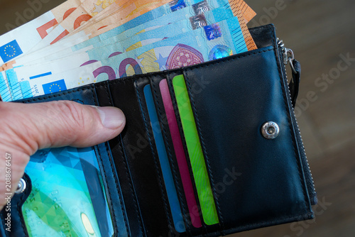 Photos Black Leather Wallet with Euro Banknotes and Payment Cards Close Up Personal Fin