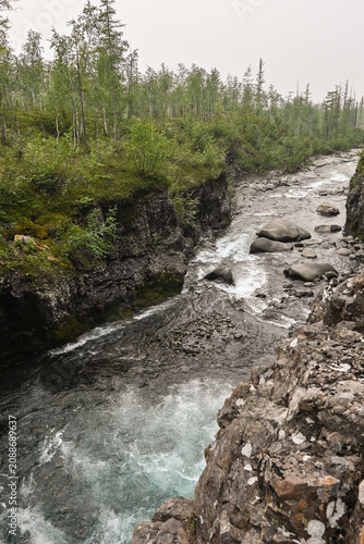 Mountain stream on a cloudy summer day.