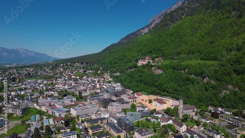 Aerial panoramic view above the downtown around the capitol city Vaduz in Liechtenstein on a sunny summer afternoon. 