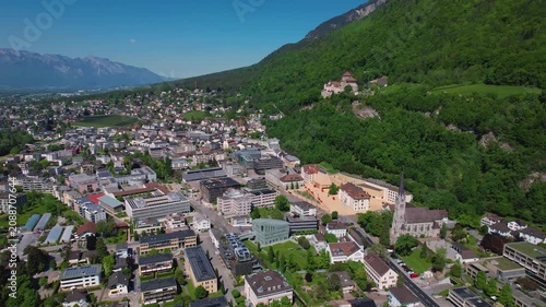 Aerial panoramic view above the downtown around the capitol city Vaduz in Liechtenstein on a sunny summer afternoon. 