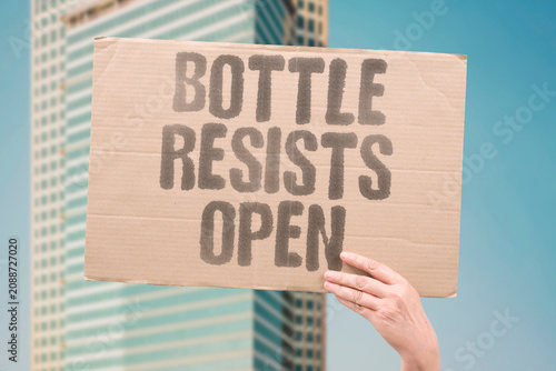 Slika na platnu "Bottle resists open" The childproof cap is stubborn today