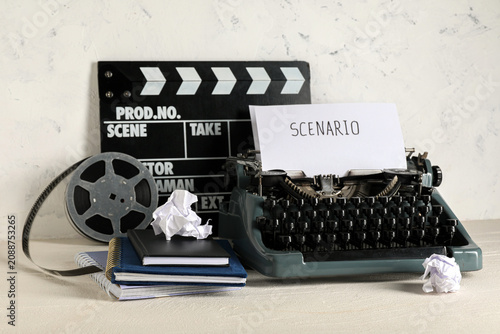 Cuadro en lienzo Vintage typewriter with scenario paper and film clapperboard