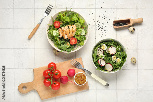 Bowls with tasty arugula sa...
