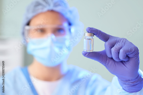 Female scientist with ampul...