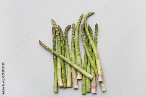 Fresh green asparagus on gr...