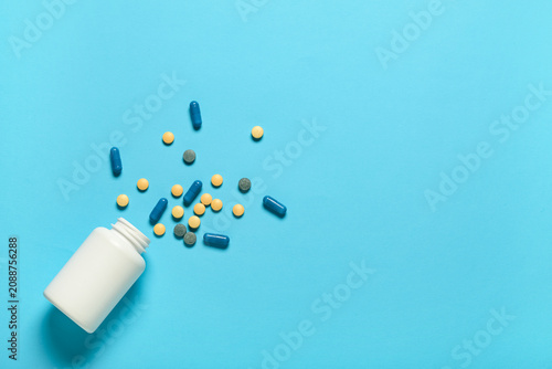 Jar with different pills on...