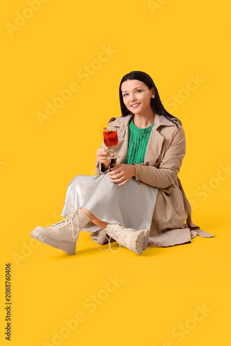 Young woman with glass of m...