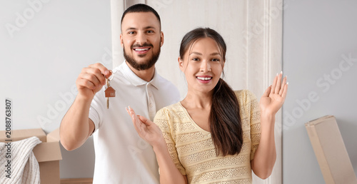 Happy couple holding house ...