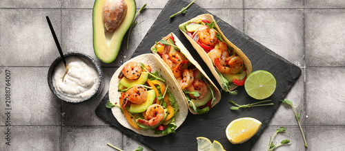 Shrimp tacos with avocado a...