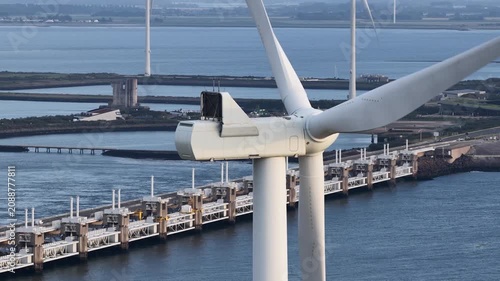 Wind turbine blades spinning generating sustainable energy at oosterscheldekering