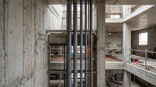 Ultra realistic vertical plumbing inside industrial building