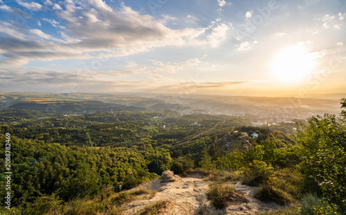 View of the mountains and Kislovodsk from the observation decks of the Kislovodsk Park. Evening sunset over the mountains of Kislovodsk.