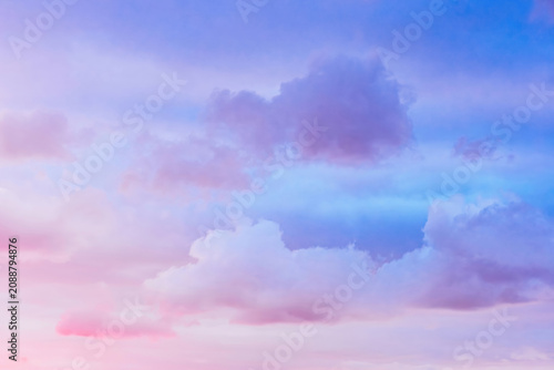 Soft pastel light blue and pink sky with light cloud coverage, clean airy sky background, serene open sky