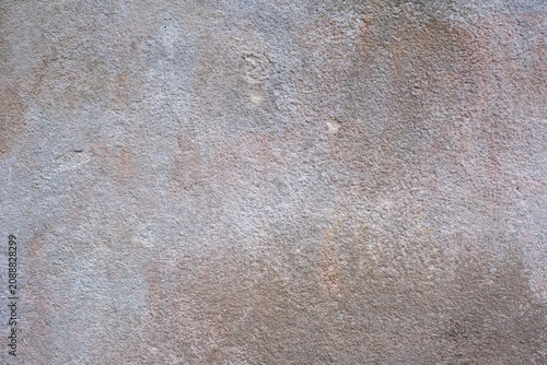 Weathered textured wall background with grey and muted earthy tones